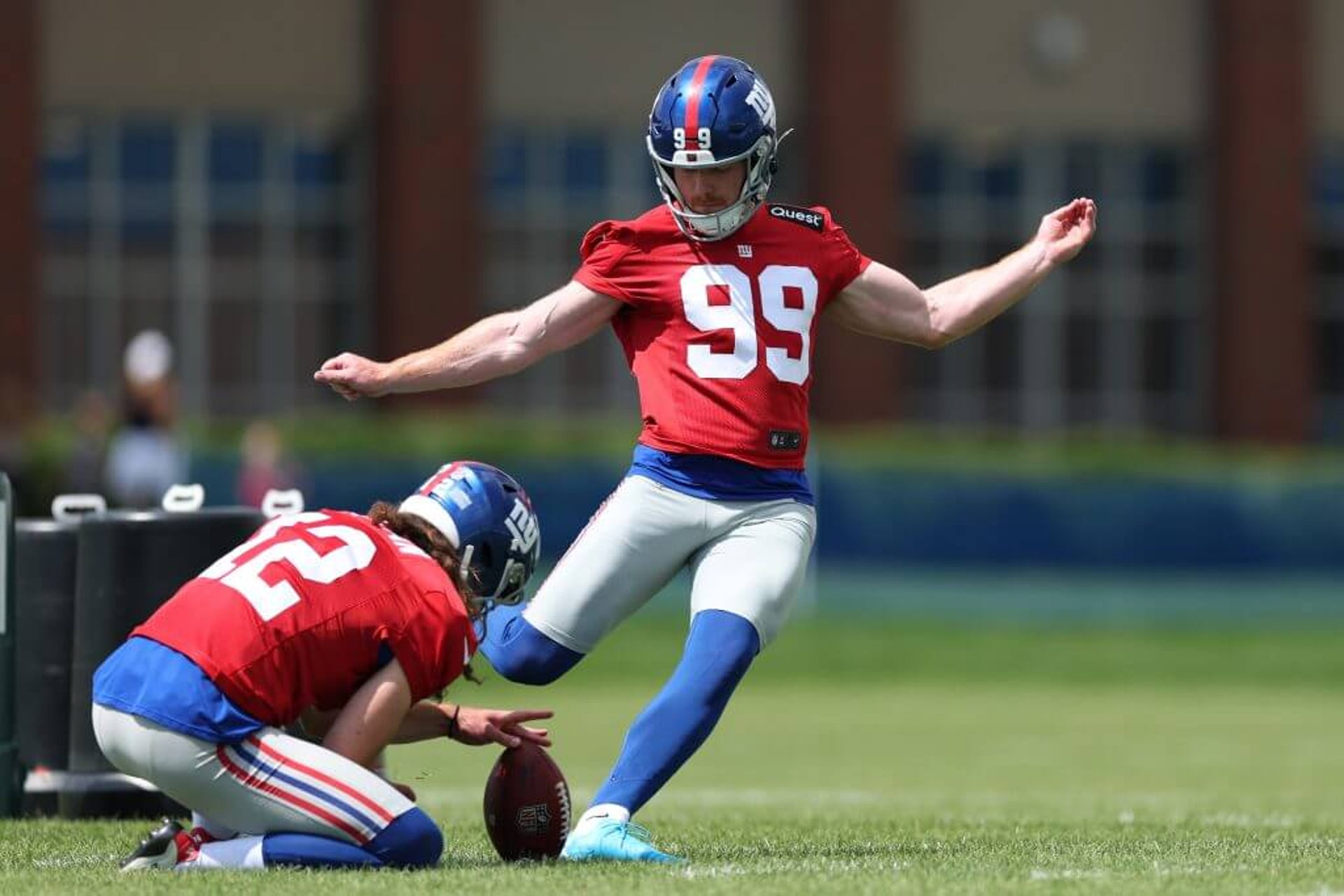 Jude McAtamney kicks the ball during Giants training camp in July.
