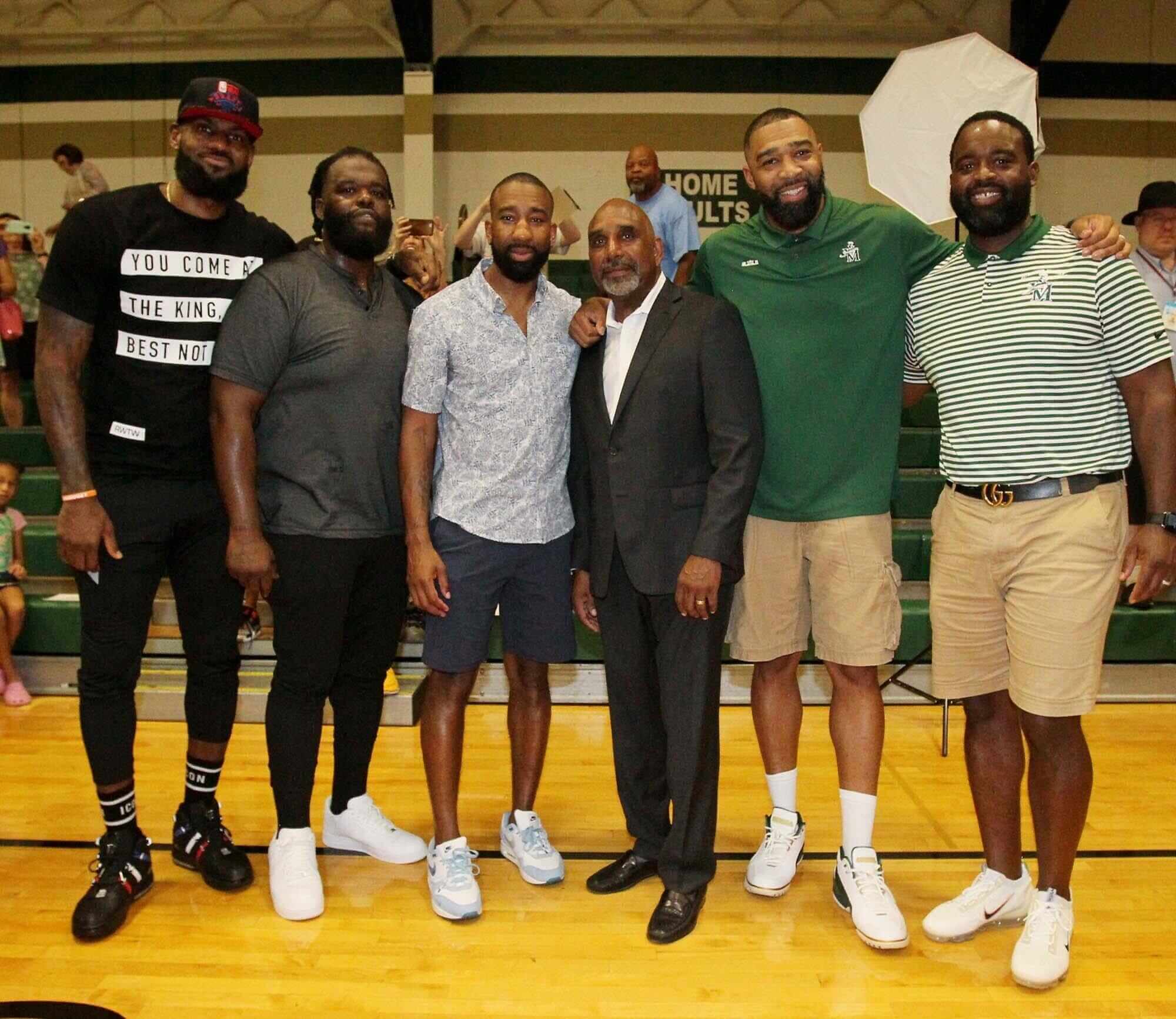 Fab Five poses for photo at Lebron James Arena.