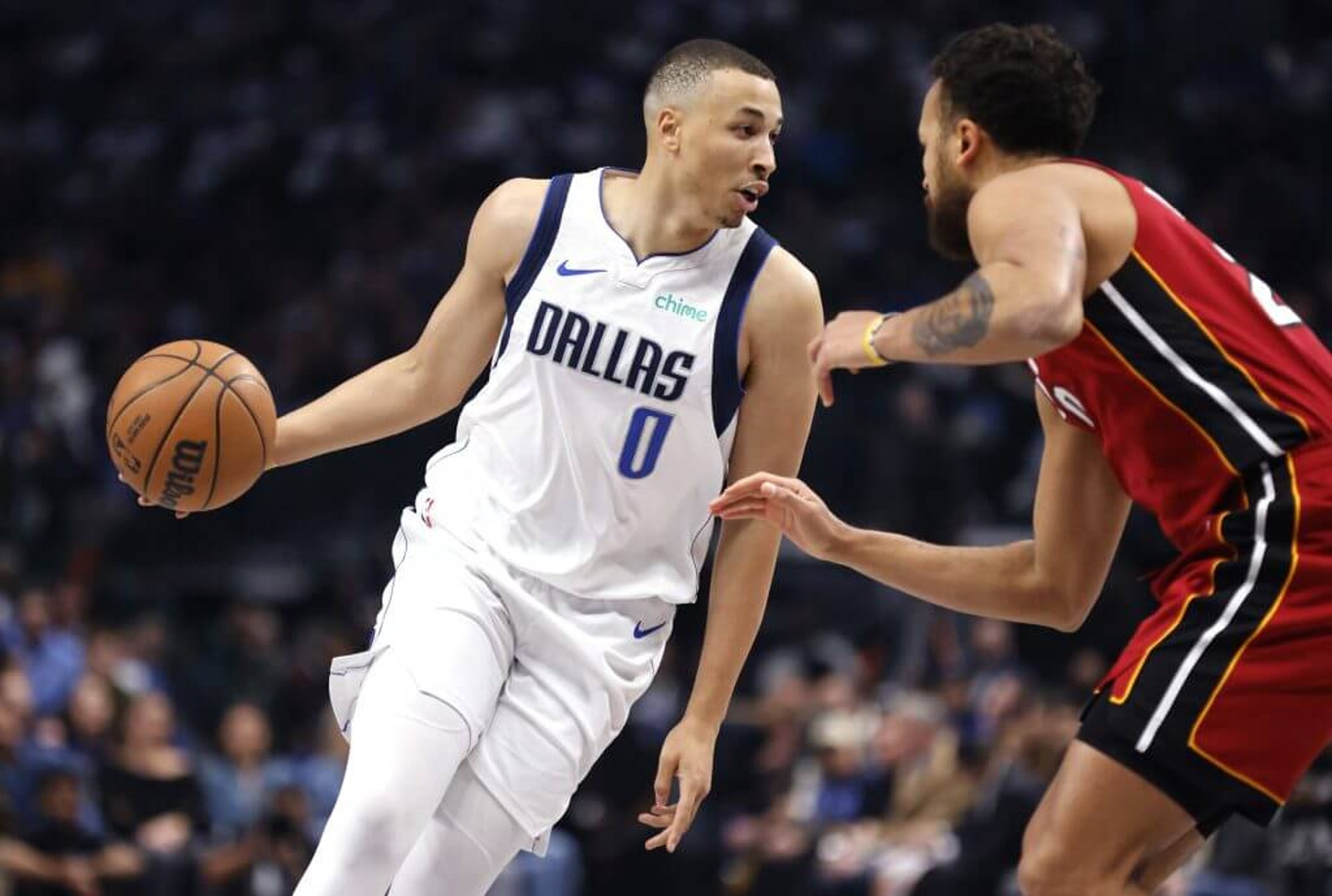 Dante Exum of the Dallas Mavericks handles the ball against Kyle Anderson of the Miami Heat during a game on Feb. 13, 2025 in Dallas.