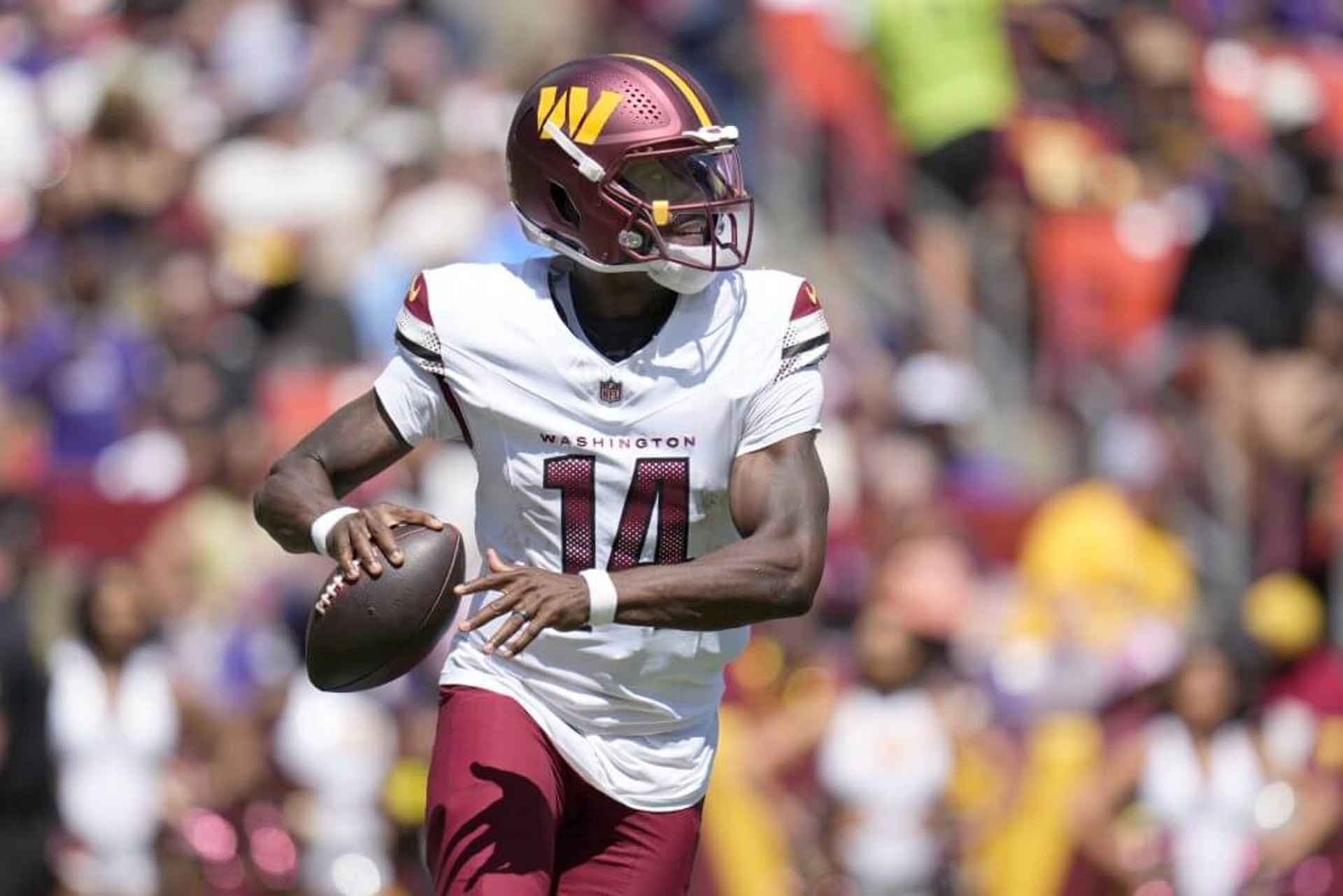 Josh Johnson #14 of the Washington Commanders looks to pass the ball during the second half of the NFL Preseason 2025 game against the Baltimore Ravens.