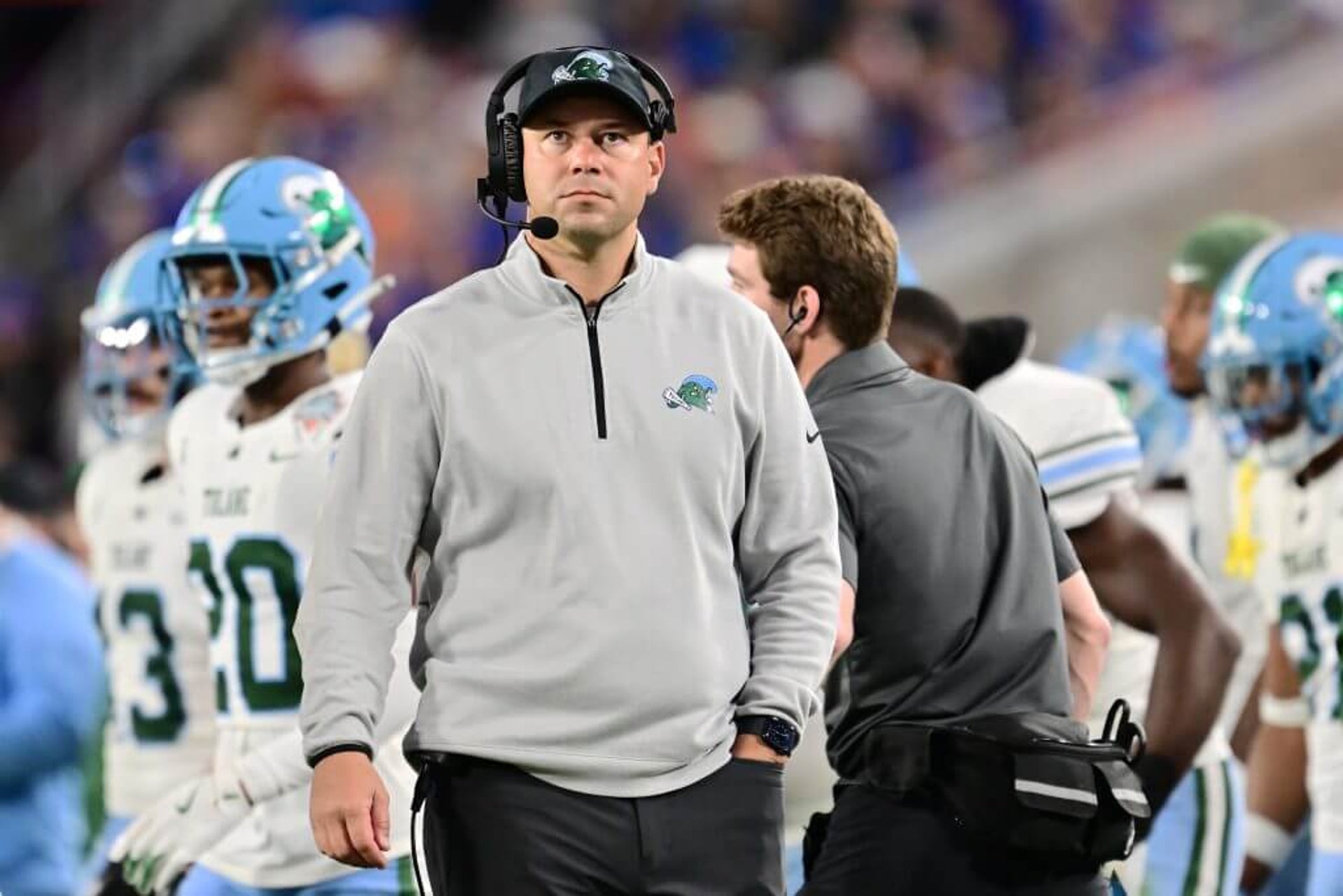 Head coach Jon Sumrall of the Tulane Green Wave looks on.