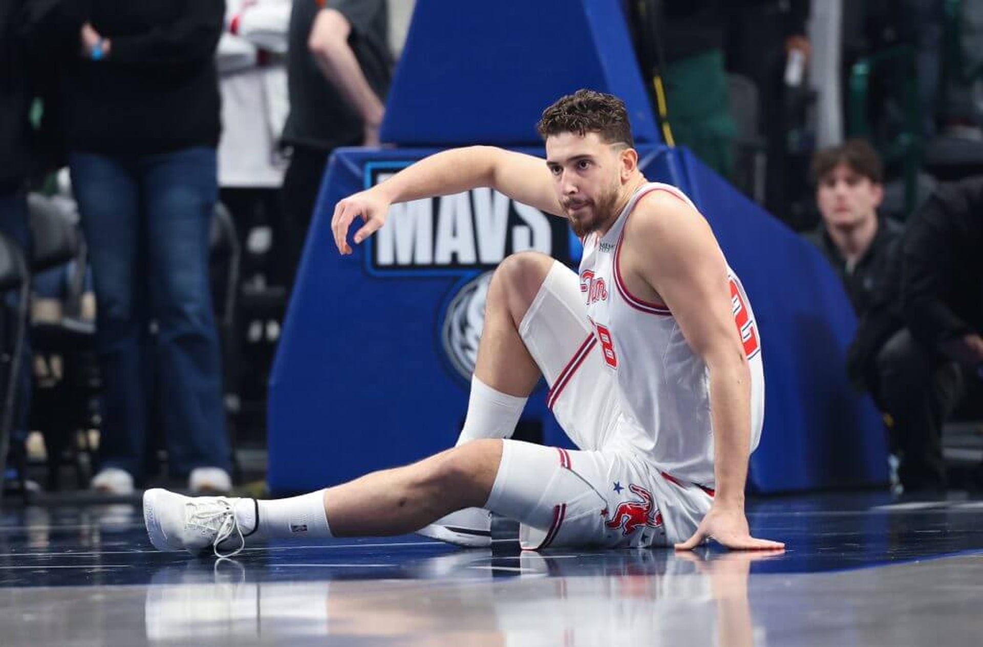 Alperen Şengün sits on the court after being injured Saturday.