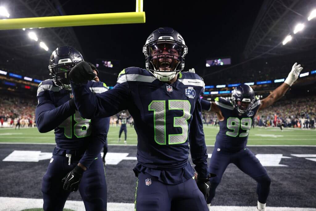 Seahawks linebacker Ernest Jones IV celebrates an interception.