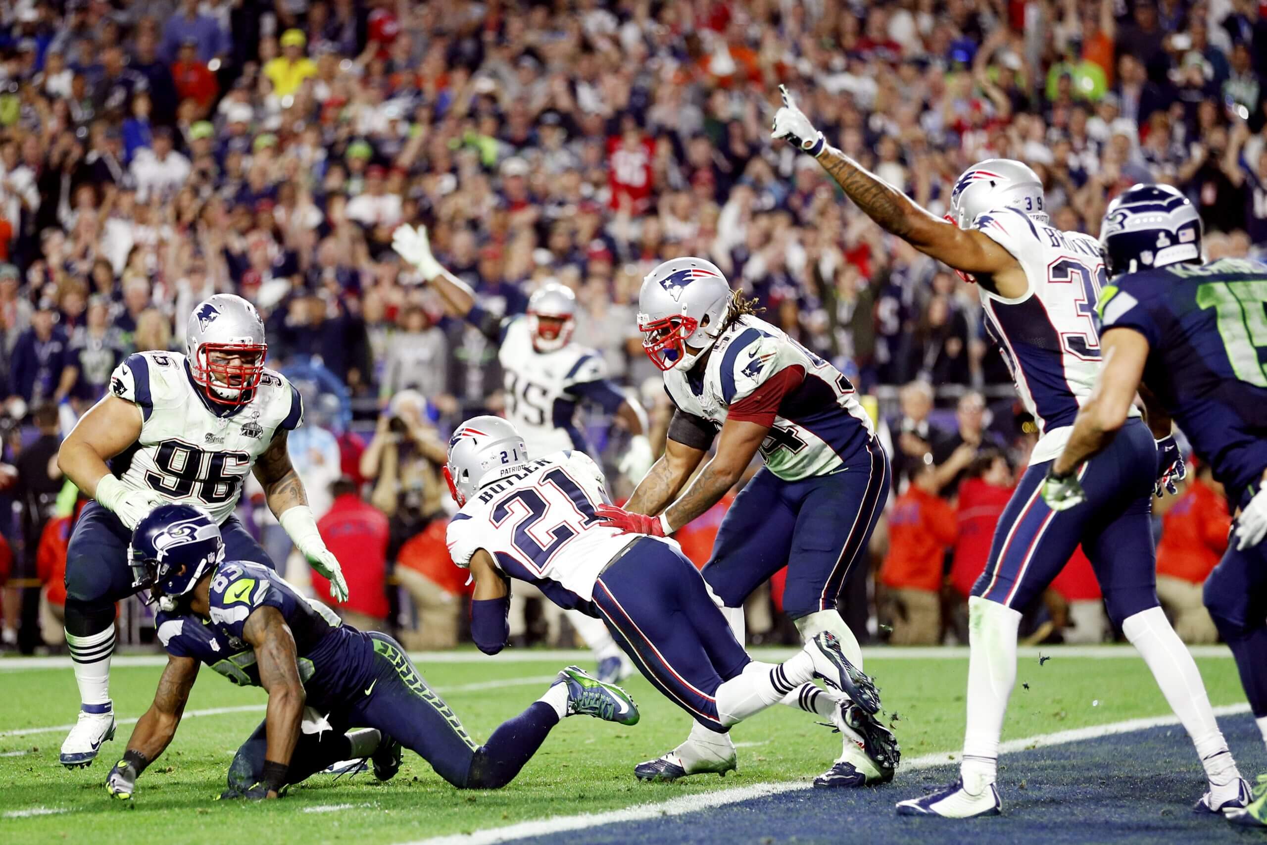 Malcolm Butler #21 of the New England Patriots intercepts a pass by Russell Wilson #3 of the Seattle Seahawks intended for Ricardo Lockette #83 late in the fourth quarter during Super Bowl XLIX.